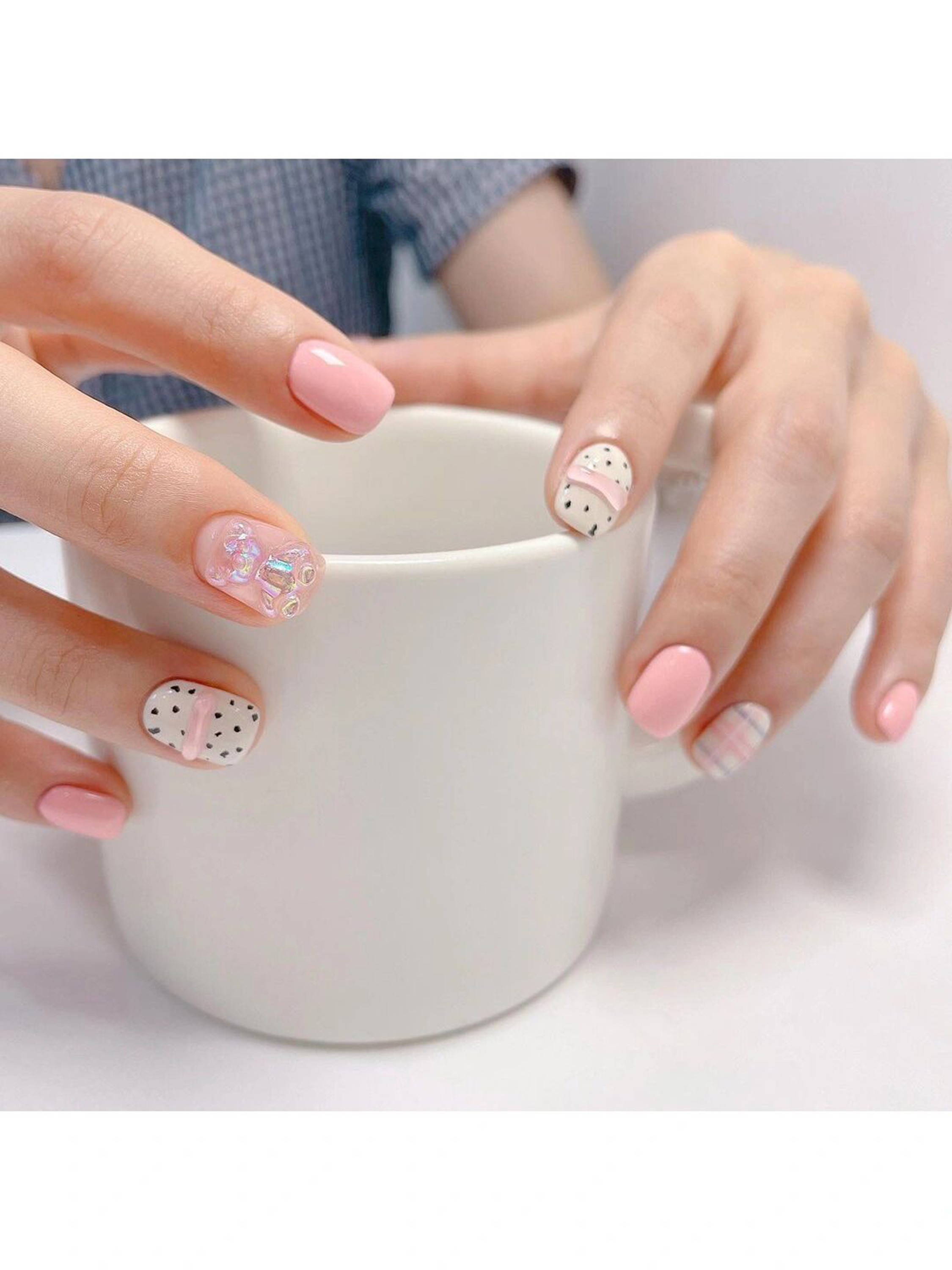 Pink and White Polka Dot Short Round Nails shown as a nail art design with pink, white, cute, gel, heart, polka dot, round and short details.