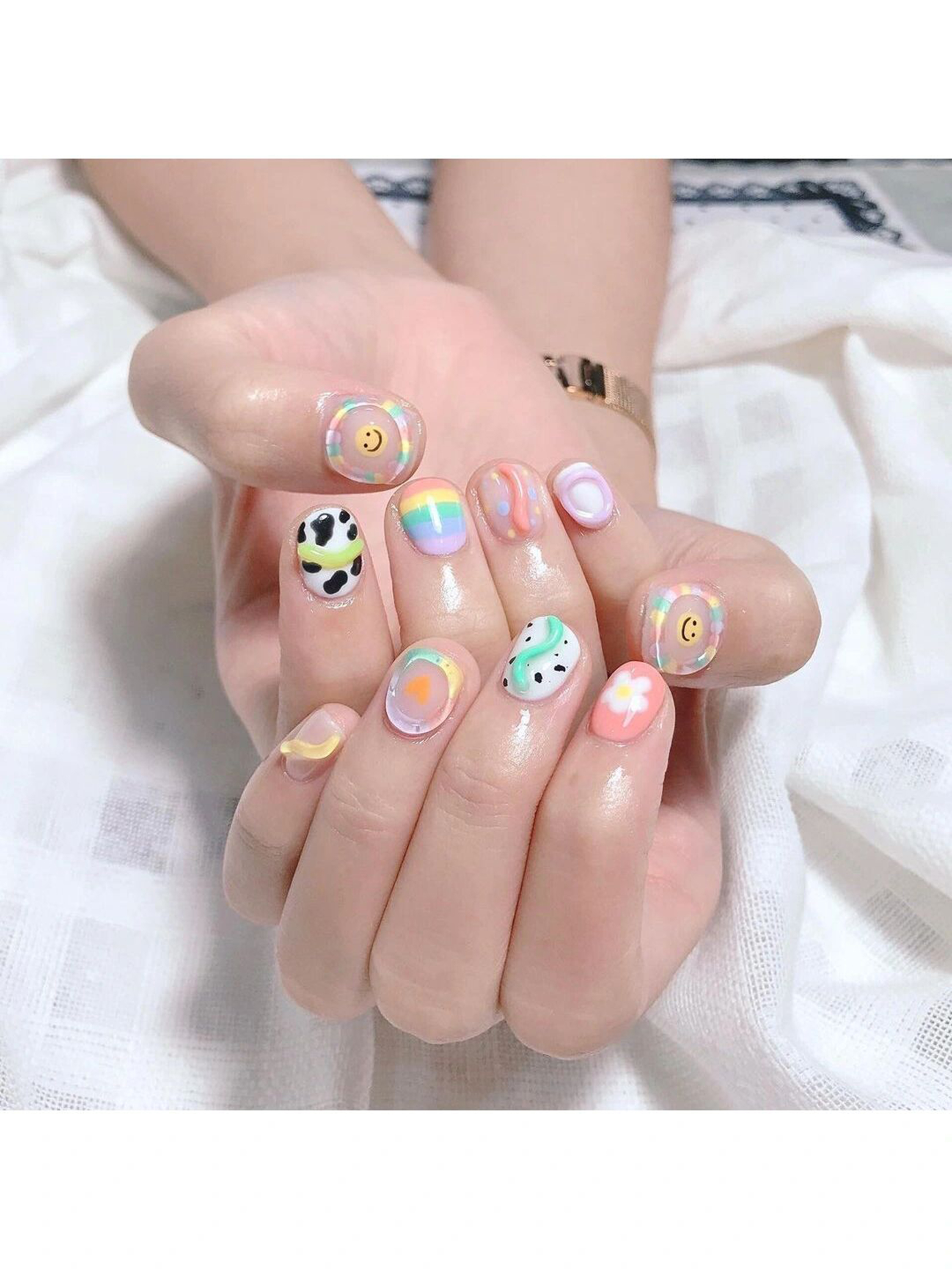 Pink, White and Blue Floral Short Round Nails shown as a nail art design with pink, white, blue, cute, gel, flower, round and short details.