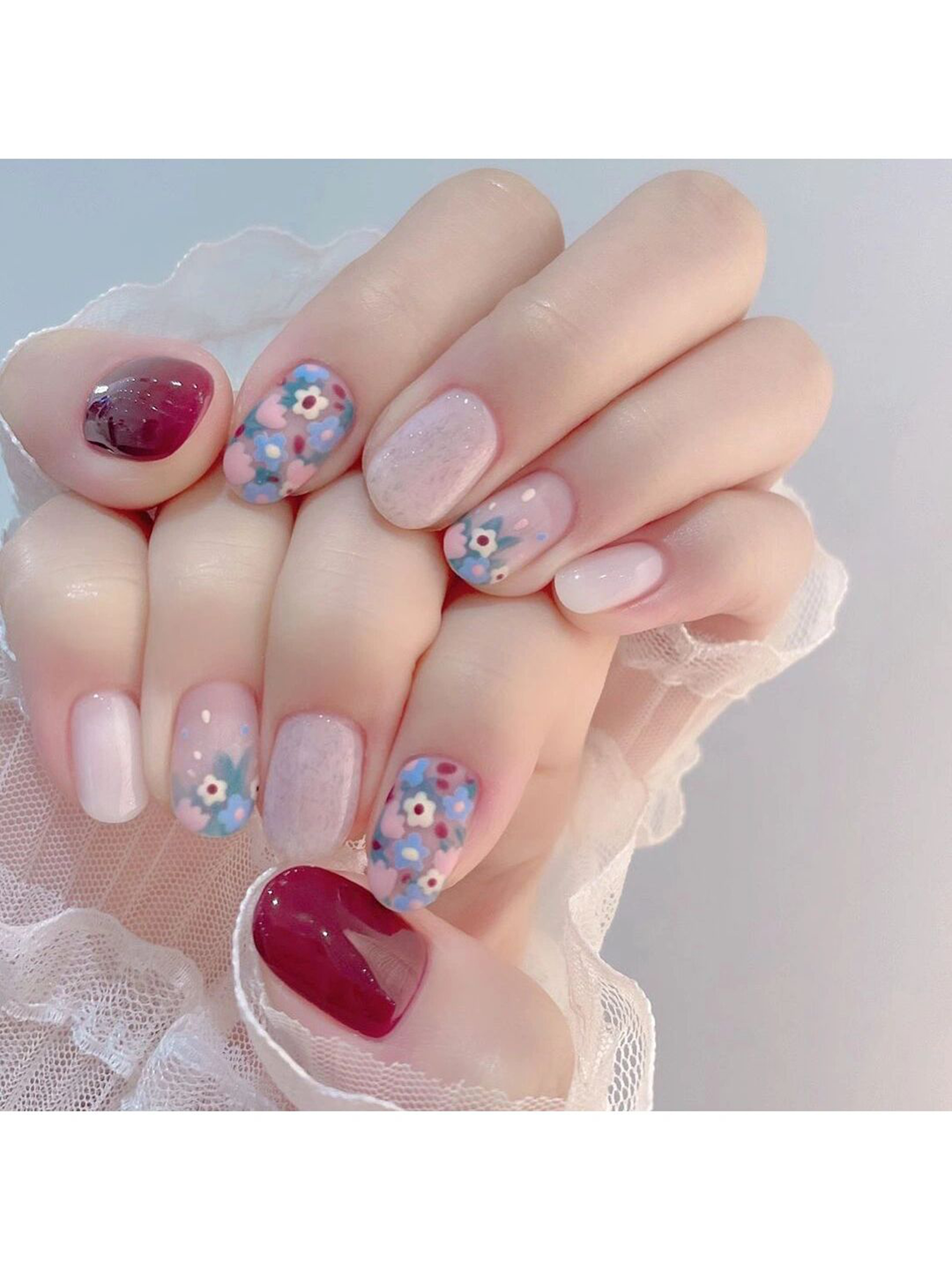 Pink, Blue and Purple Floral Short Round Nails shown as a nail art design with pink, blue, purple, cute, abstract, flower, round and short details.