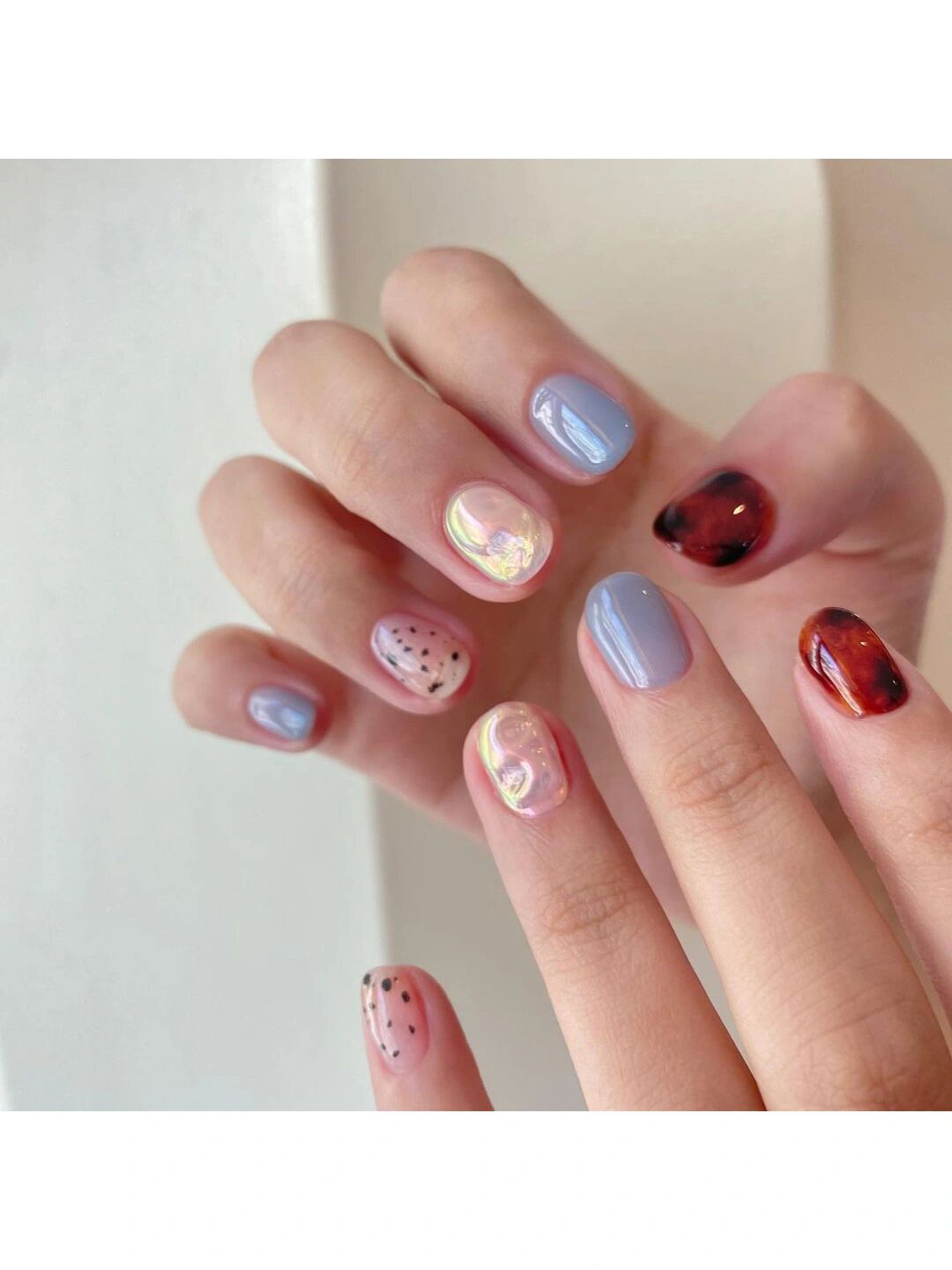 Nude, Red and Blue Polka Dot Short Round Nails shown as a nail art design with nude, red, blue, cute, heart, polka dot, round and short details.
