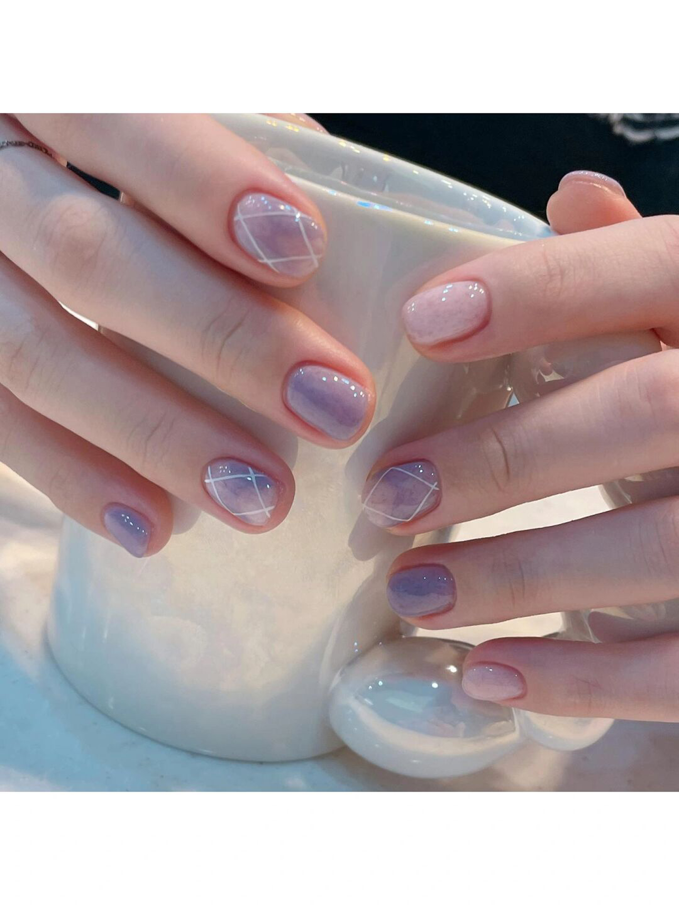 Purple and White Marble Short Round Nails shown as a nail art design with purple, white, marble, round and short details.