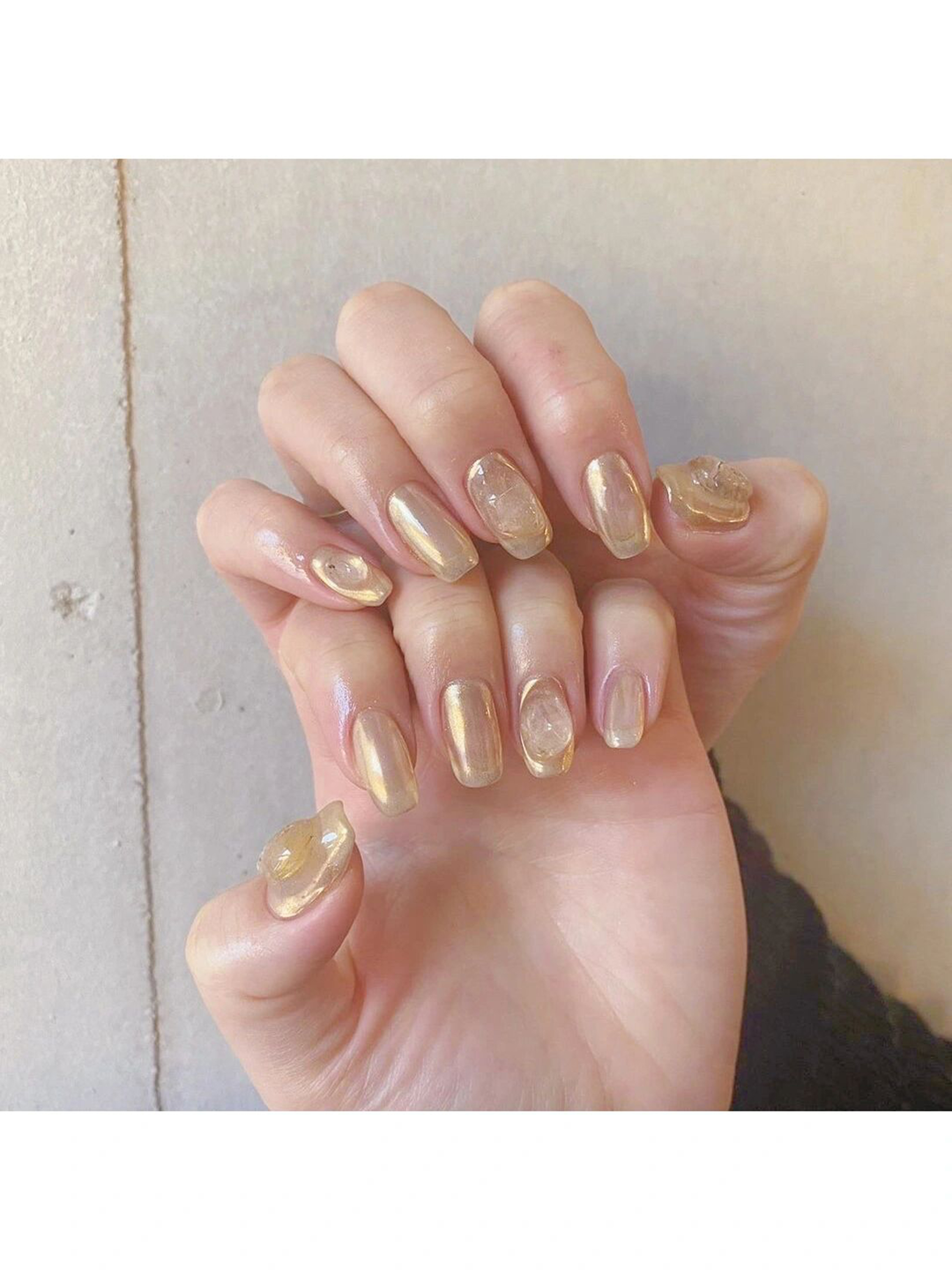 Gold Chrome Short Round Nails shown as a nail art design with gold, elegant, chrome, round and short details.