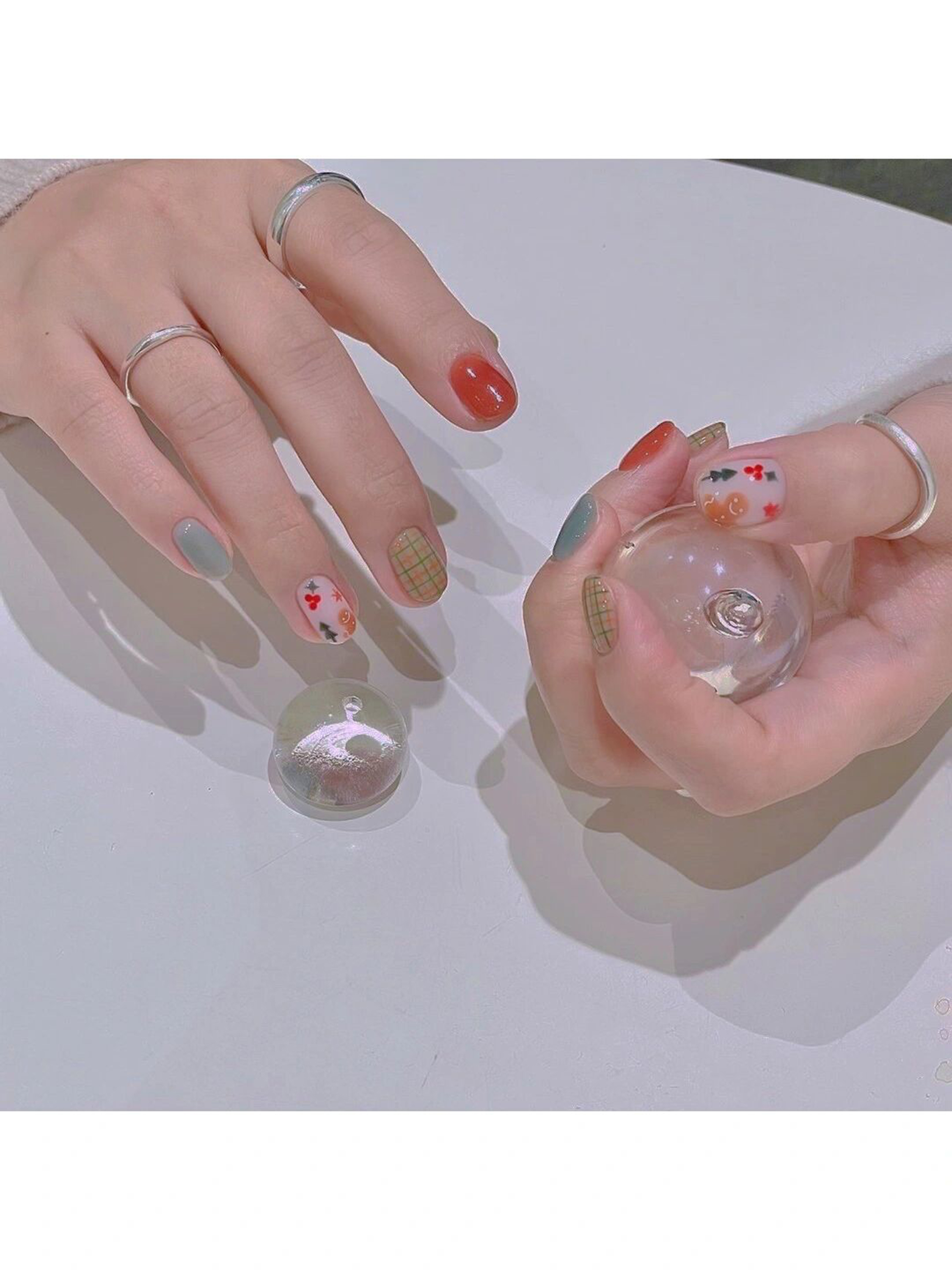 Red, Green and White Heart Nails shown as a nail art design with red, green, white, cute, heart and medium details.