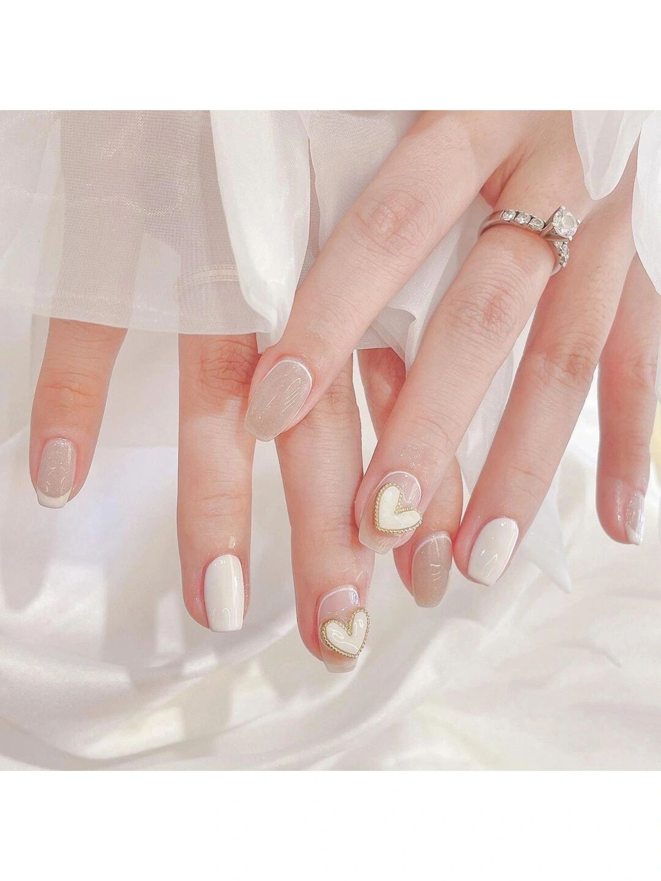 Nude Heart Oval Nails shown as a nail art design with nude, elegant, minimal, heart, oval and medium details.