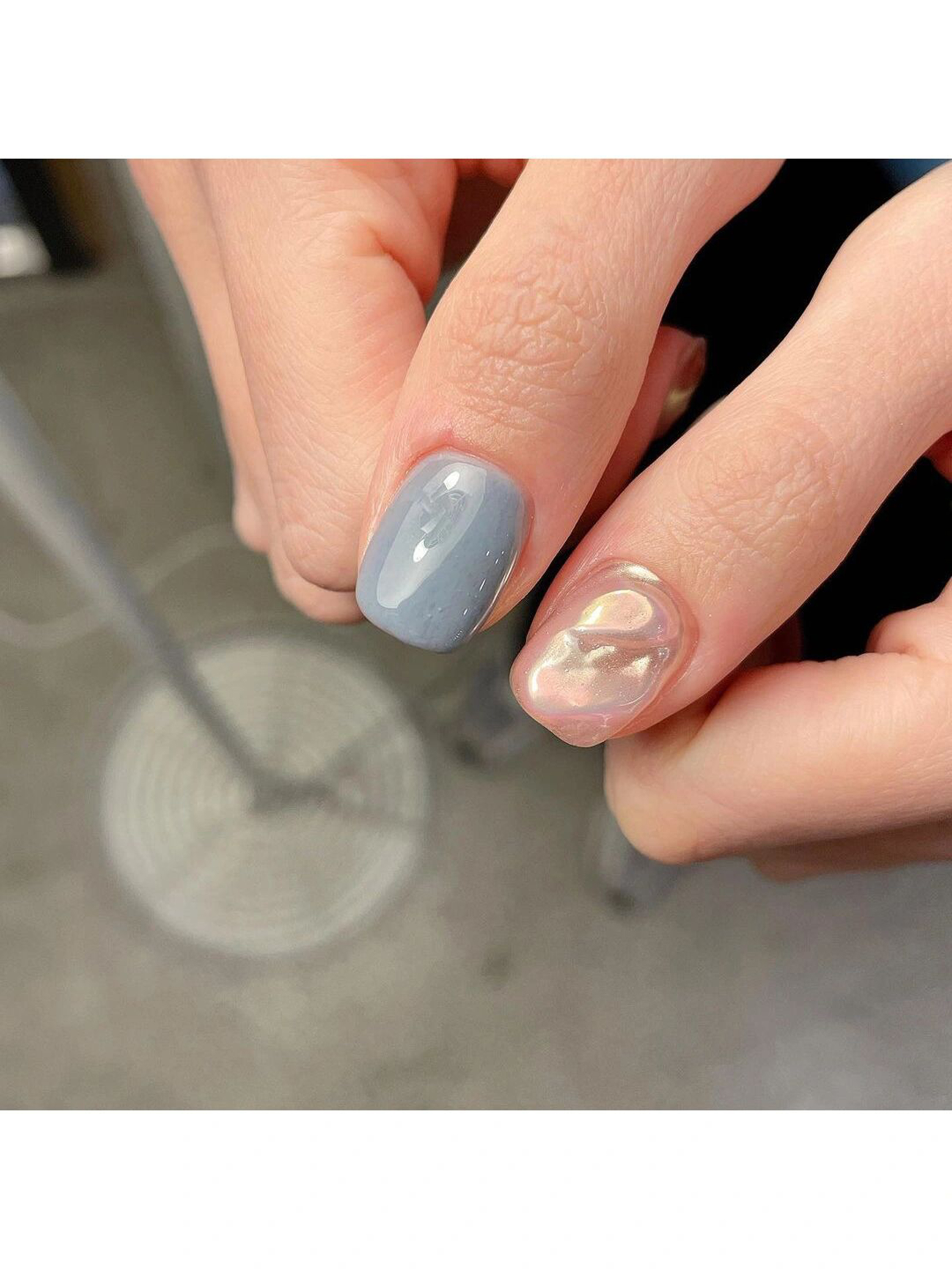 Gray Abstract Short Round Nails shown as a nail art design with gray, chrome, swirl, round and short details.