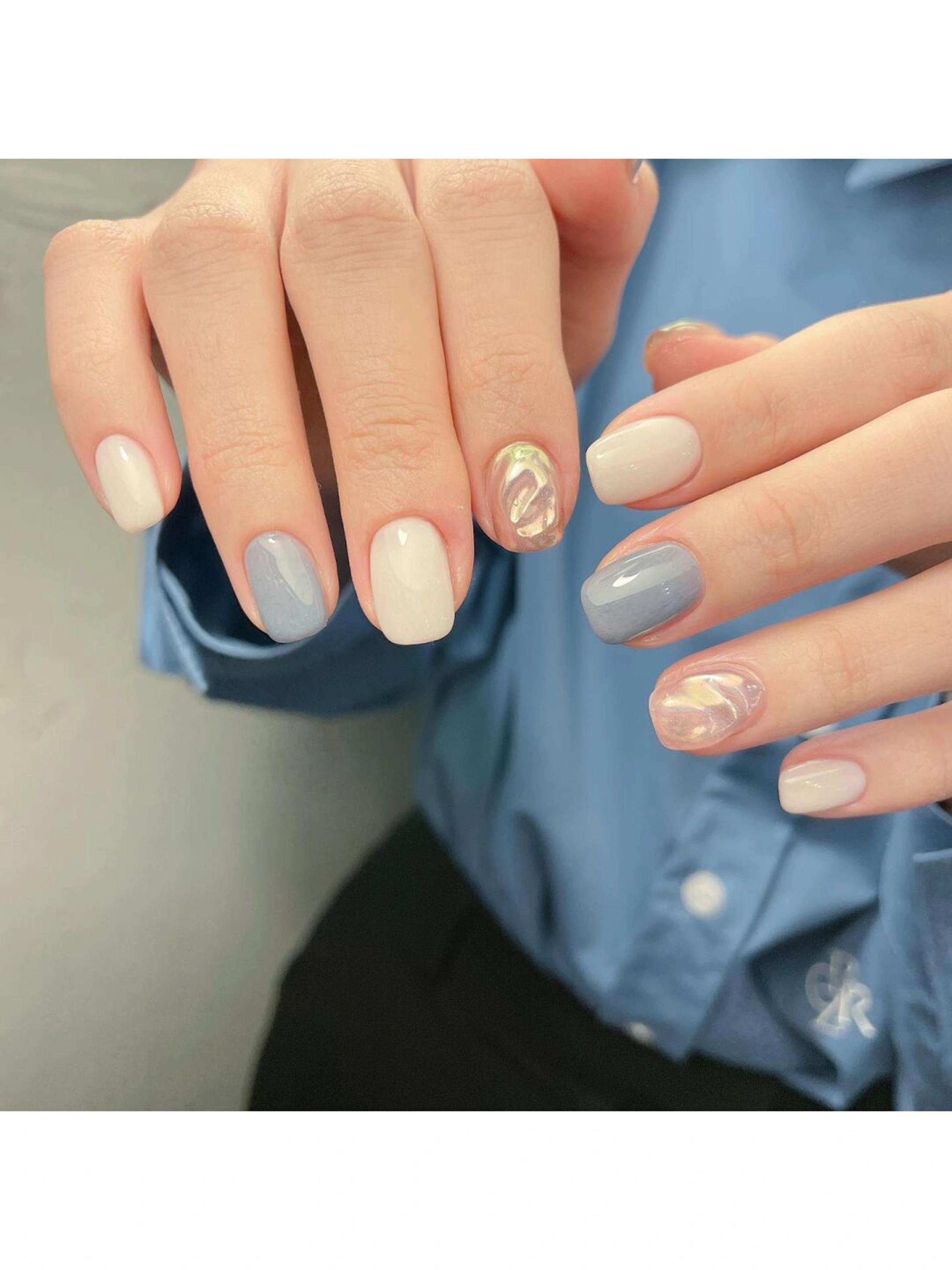 Baby Blue Marble Oval Nails shown as a nail art design with baby blue, elegant, marble, oval and medium details.