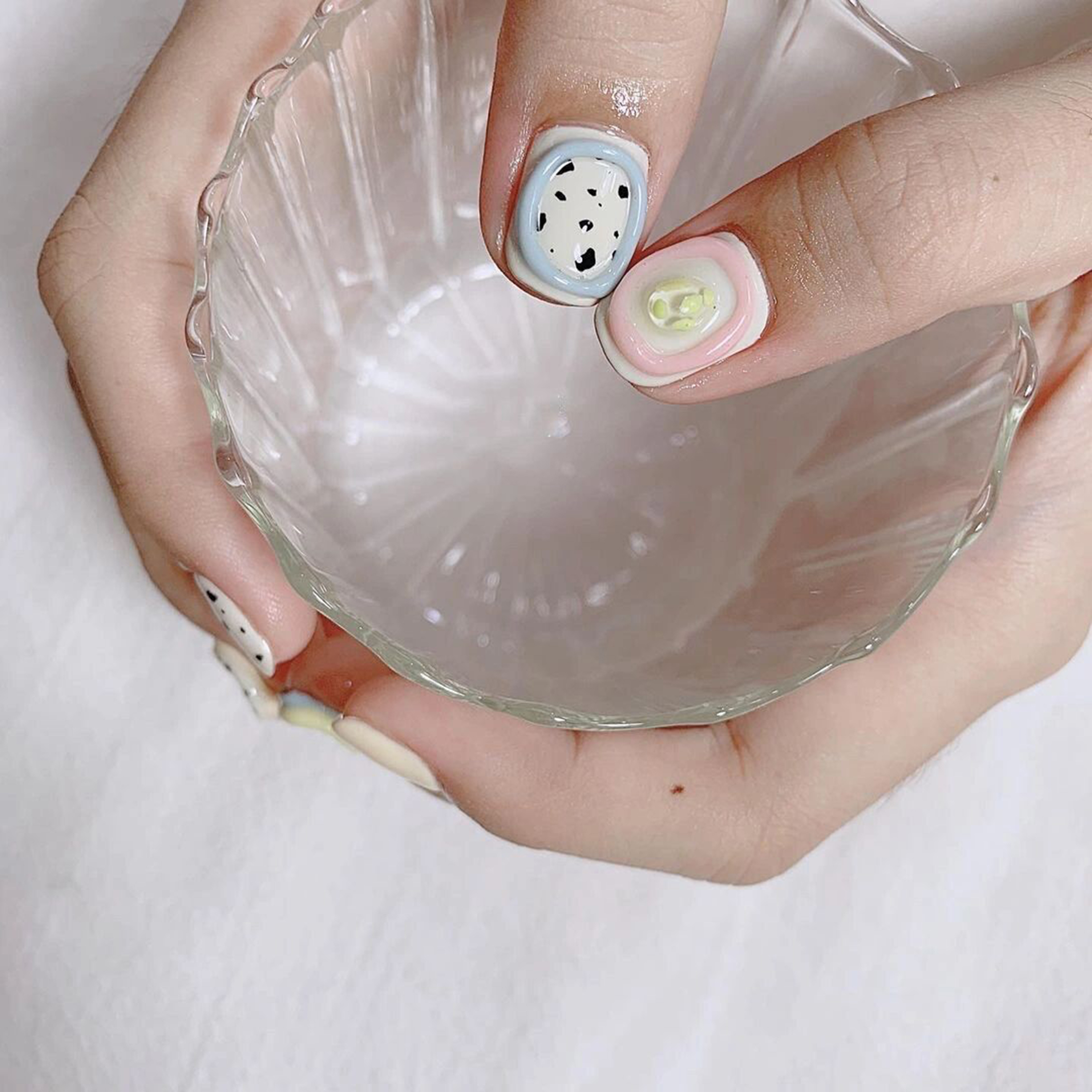 Pink, White and Baby Blue Polka Dot Short Nails shown as a nail art design with pink, white, baby blue, minimal, polka dot and short details.