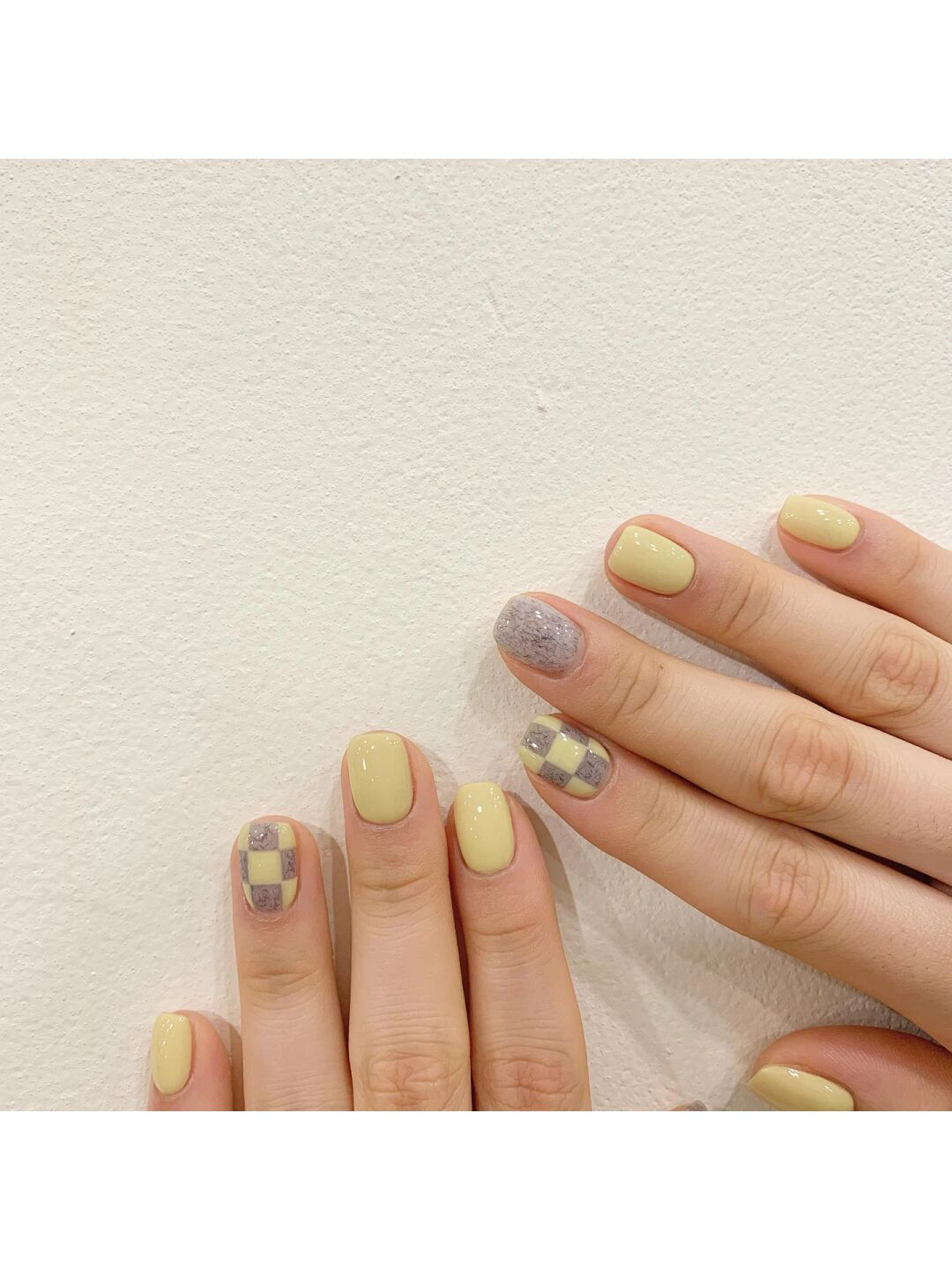 Silver and Butter Yellow Checkerboard Short Nails shown as a nail art design with silver, butter yellow, cute, glitter, checkerboard and short details.