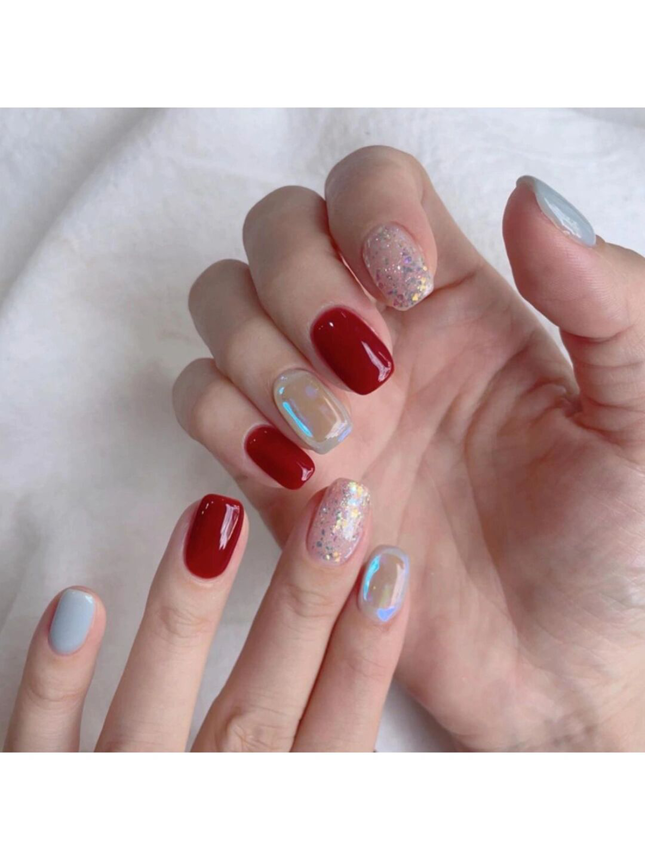 Red Chrome Short Oval Nails shown as a nail art design with red, glitter, chrome, oval and short details.