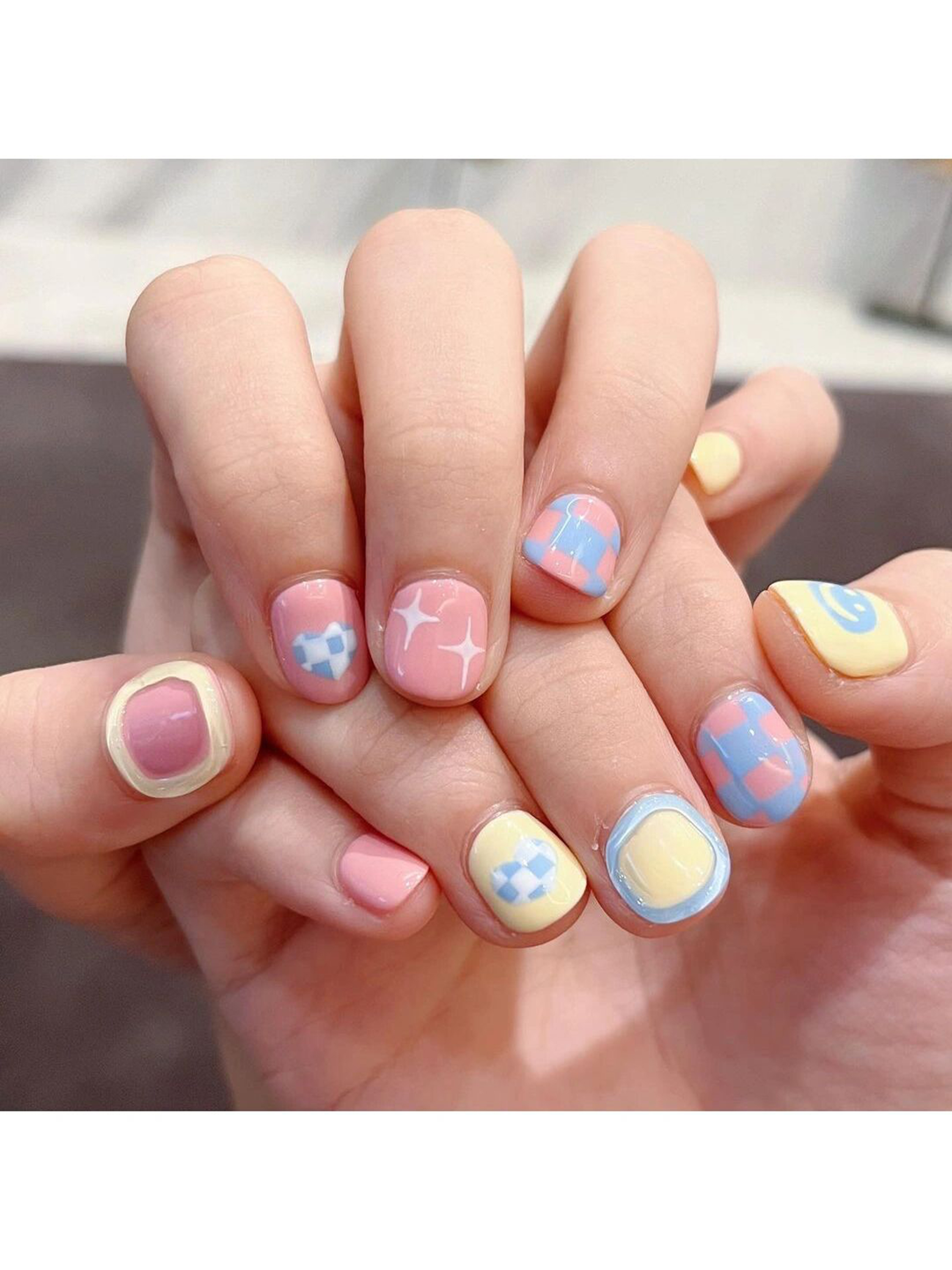 Pink, Baby Blue and Butter Yellow Checkerboard Short Nails shown as a nail art design with pink, baby blue, butter yellow, cute, checkerboard, swirl and short details.