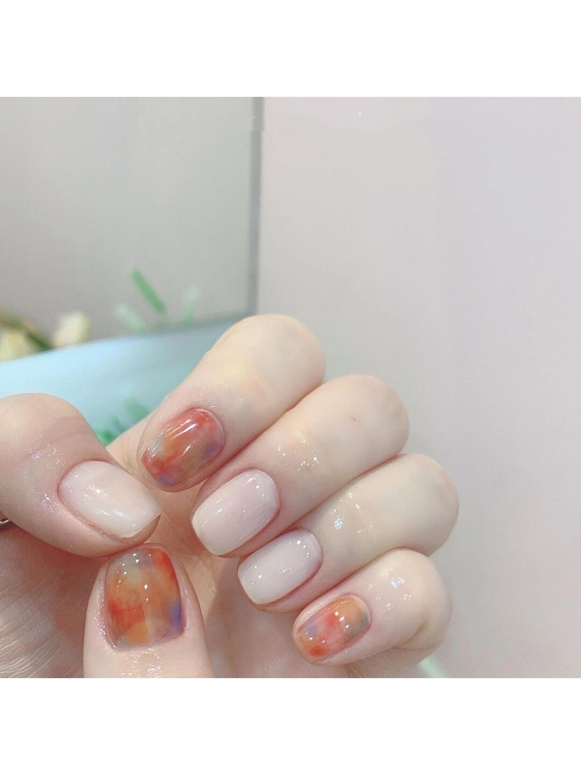 Nude and Pastel Marble Short Round Nails shown as a nail art design with nude, pastel, marble, aesthetic, round and short details.