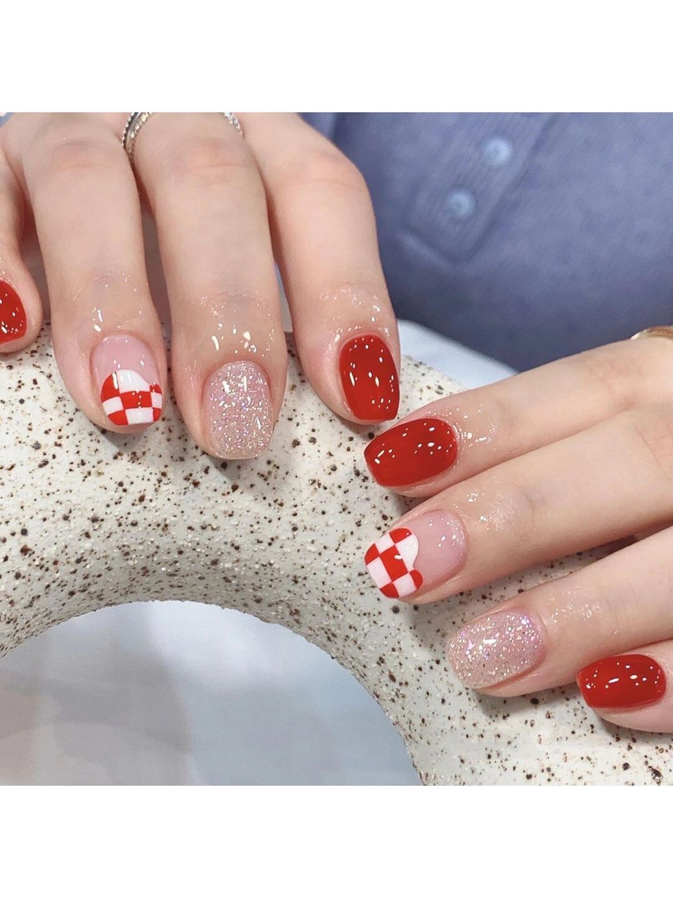 Red and White Checkerboard Short Round Nails shown as a nail art design with red, white, glitter, cute, checkerboard, heart, round and short details.
