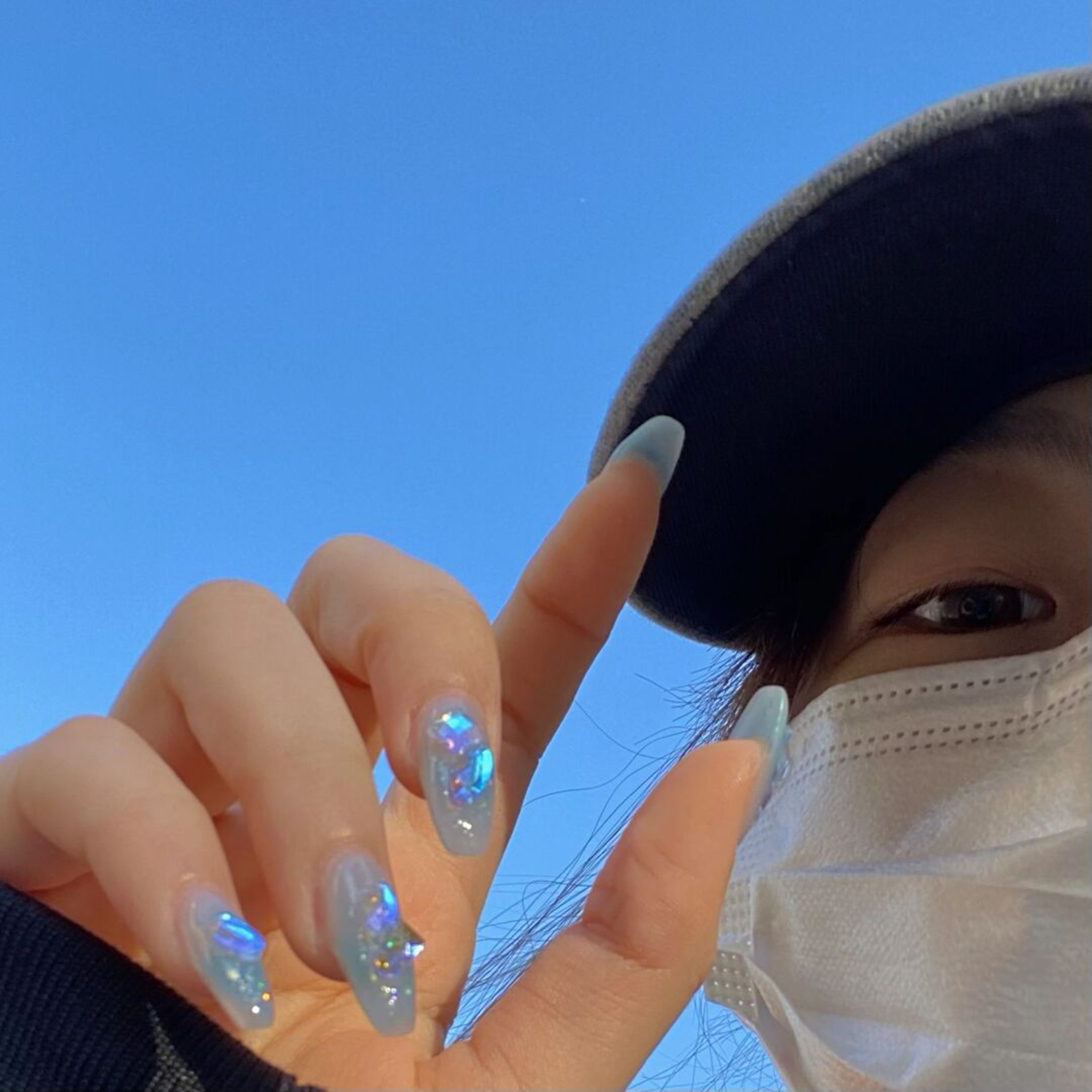 Blue Chrome Long Almond Nails shown as a nail art design with blue, chrome, almond and long details.
