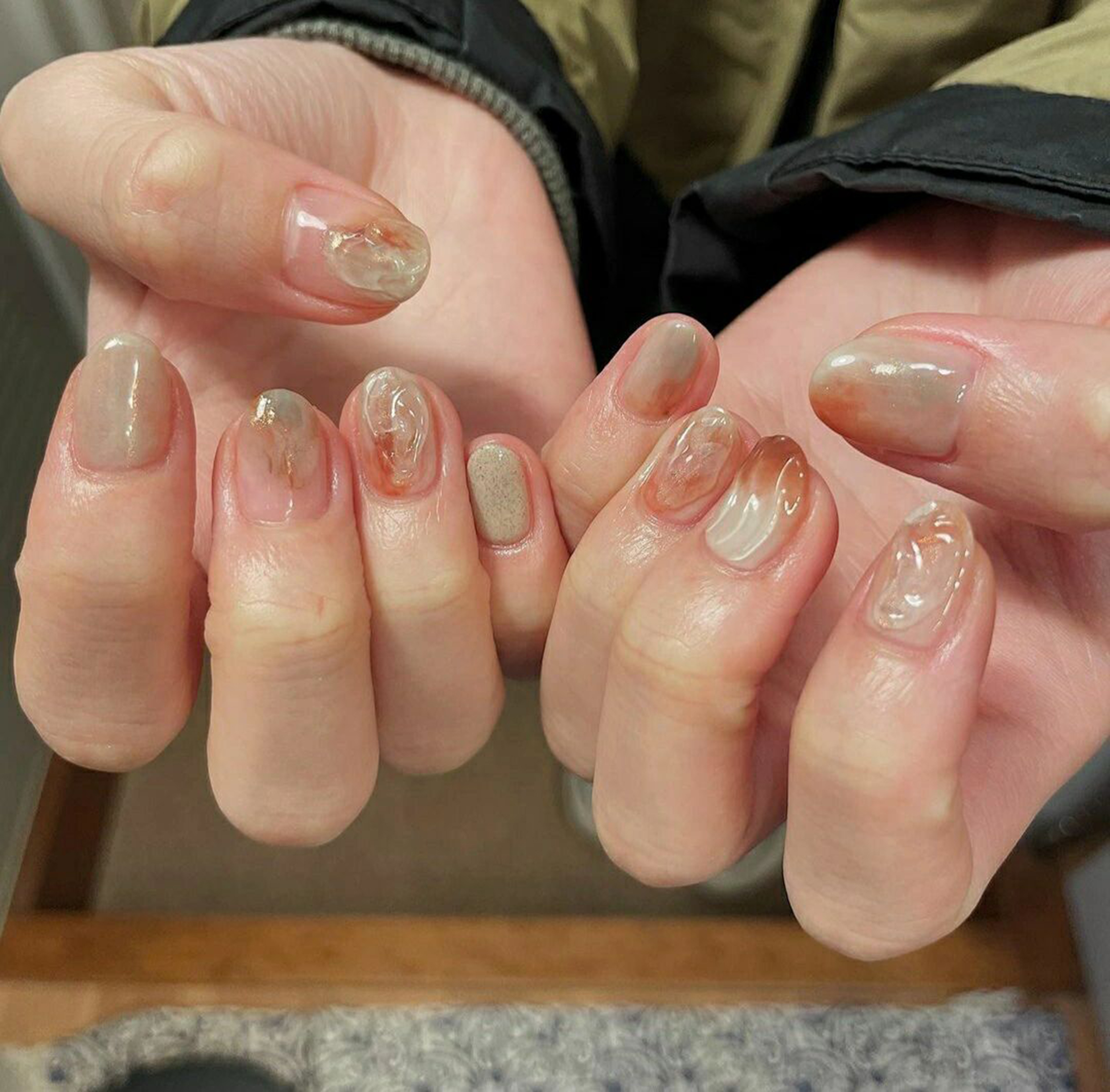 Nude Brown Marble Medium Oval Nails with nude, brown, marble, elegant, swirl, oval and medium details.