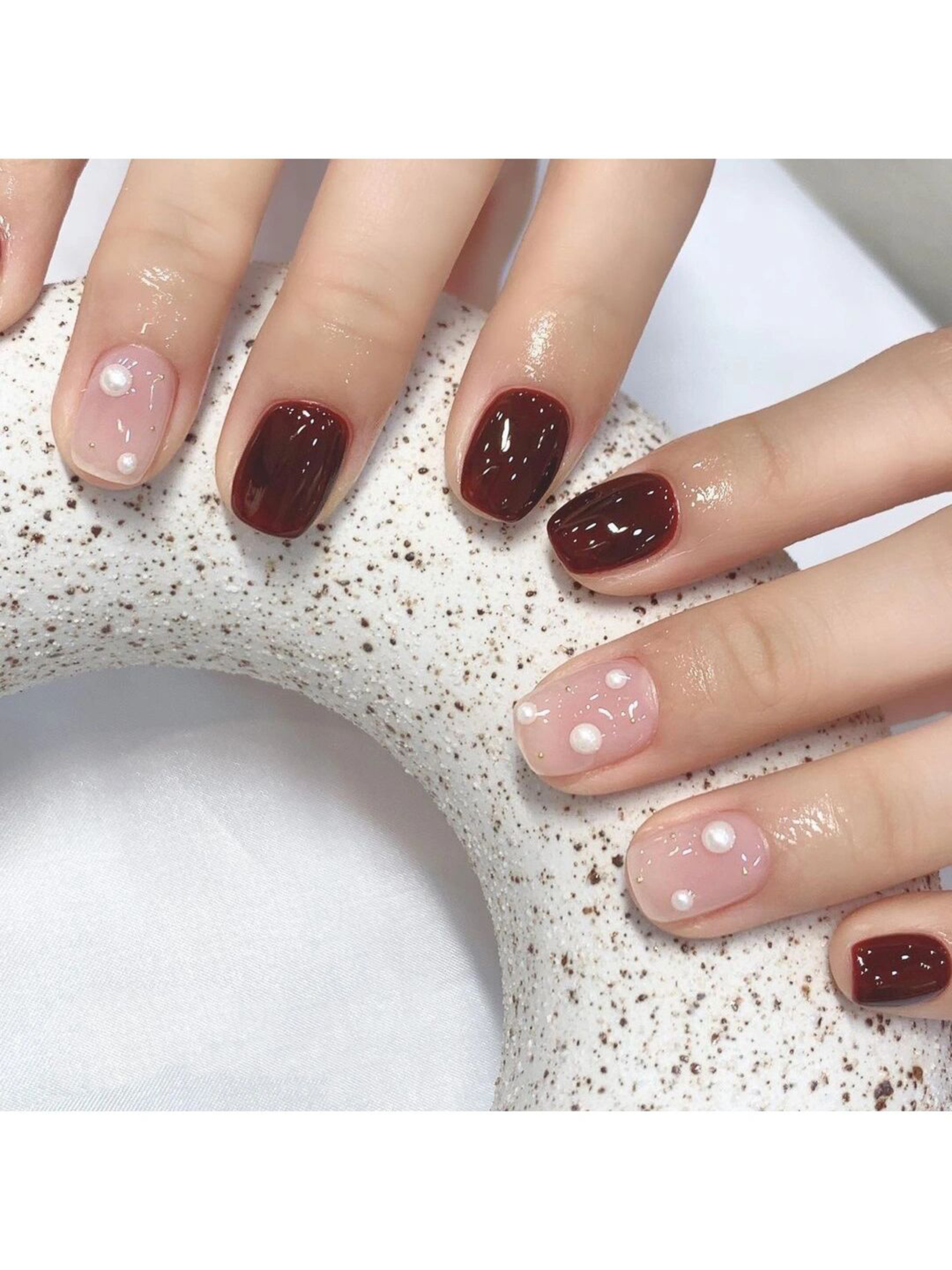Nude and Burgundy Simple Short Nails shown as a nail art design with nude, burgundy, simple and short details.