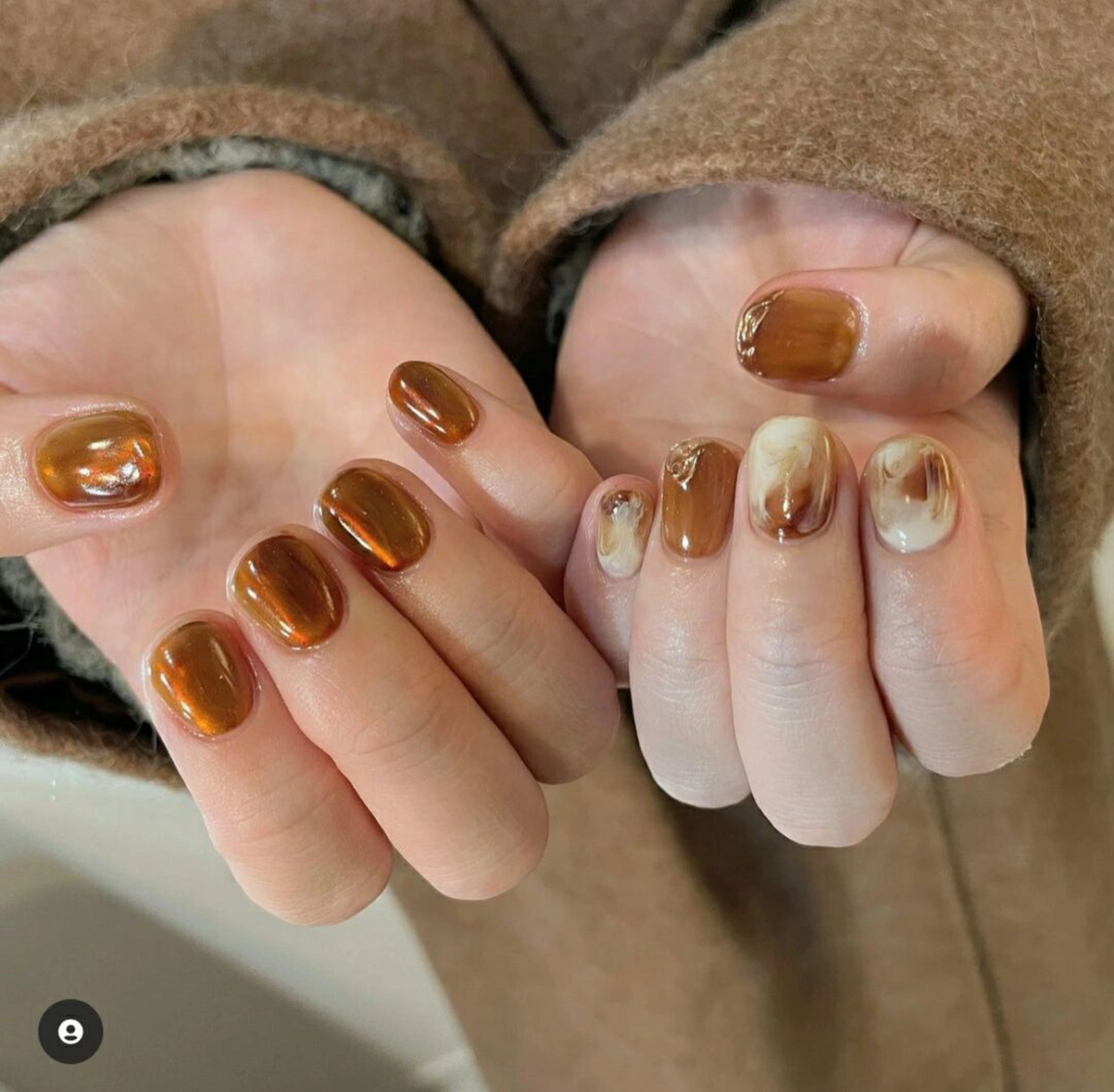 Brown and Beige Abstract Round Nails shown as a nail art design with brown, beige, marble, swirl, round and medium details.