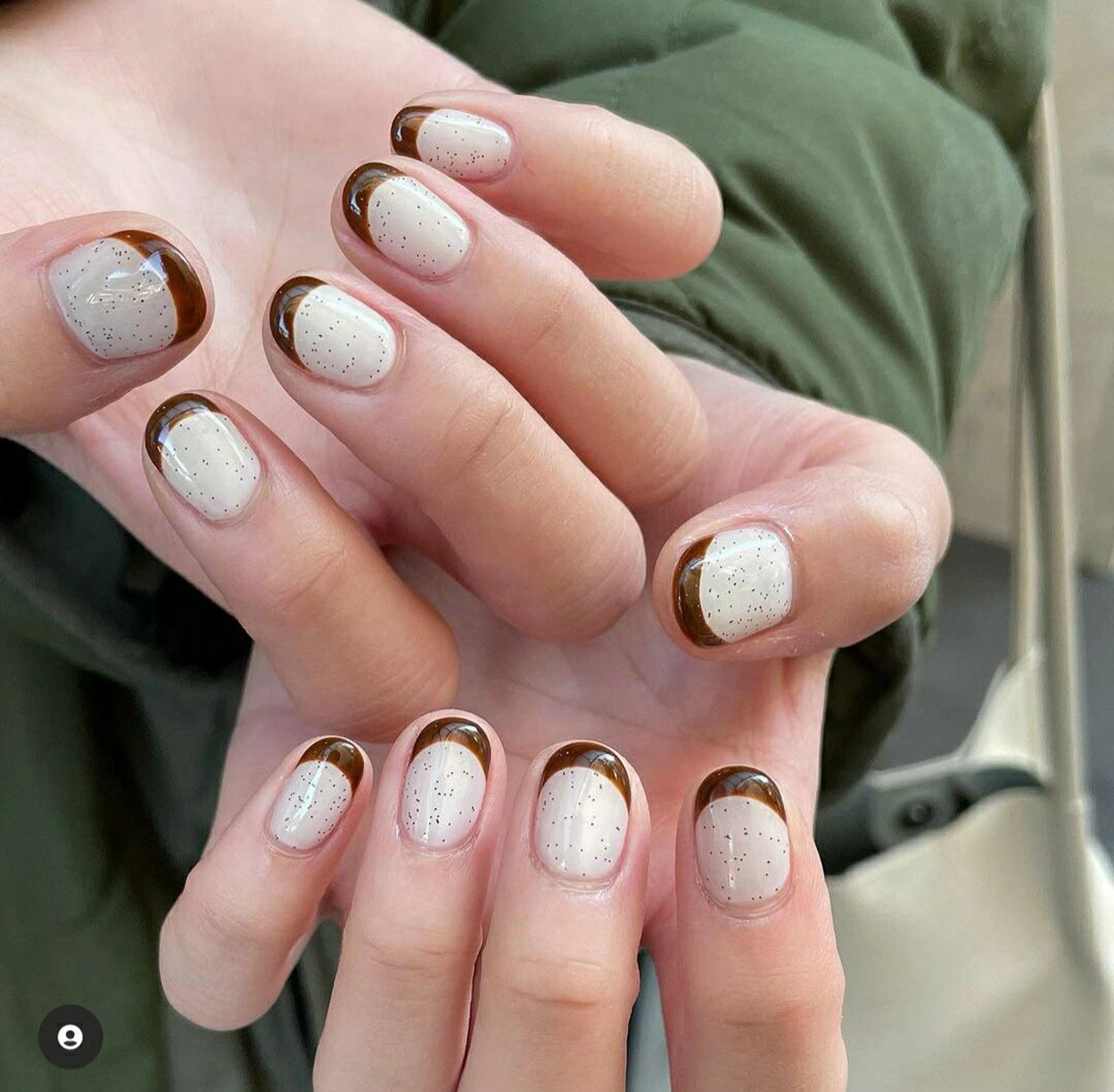 Brown French Tip Short Oval Nails shown as a nail art design with brown, minimal, french, oval and short details.