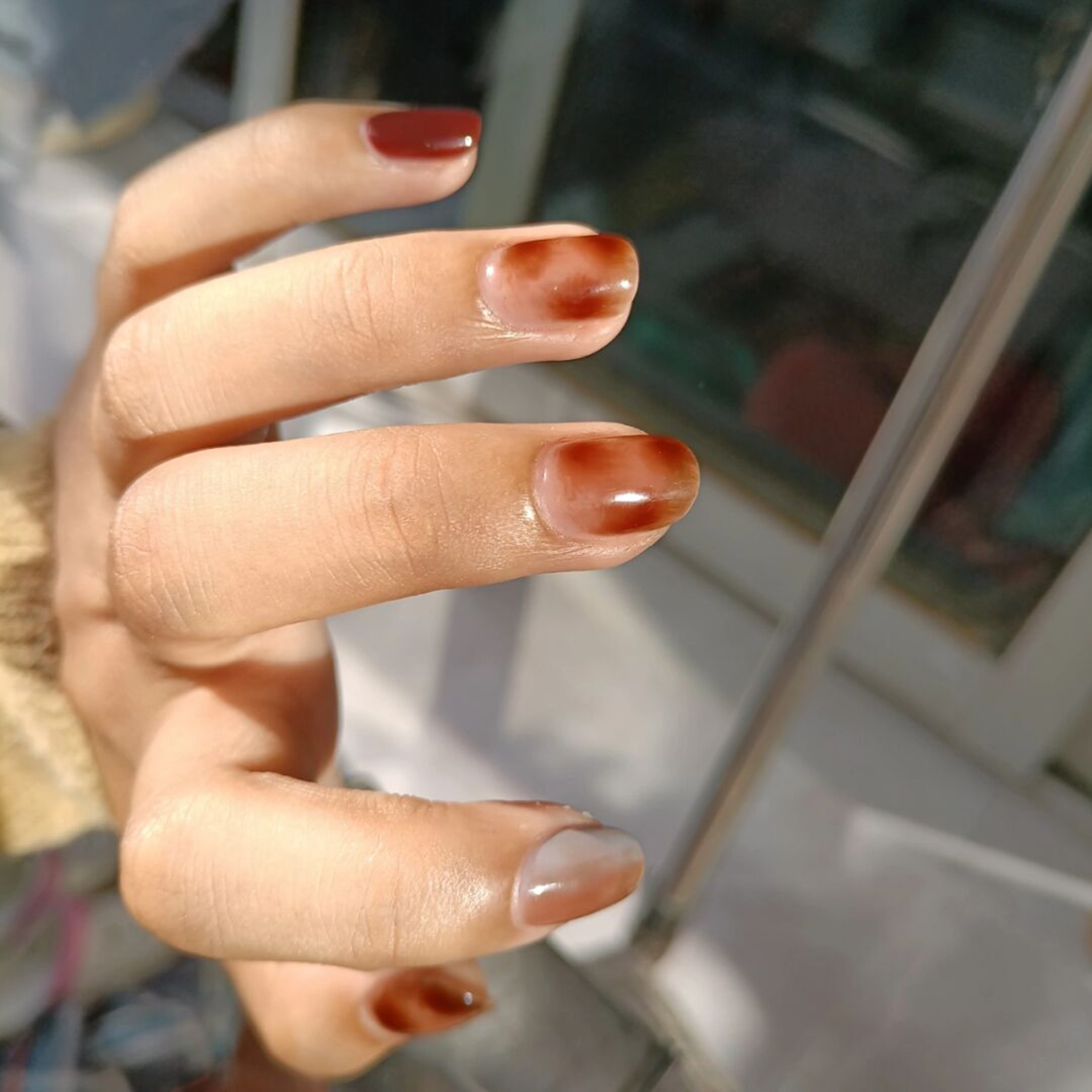 Brown and Nude Marble Nails shown as a nail art design with brown, nude, marble and medium details.