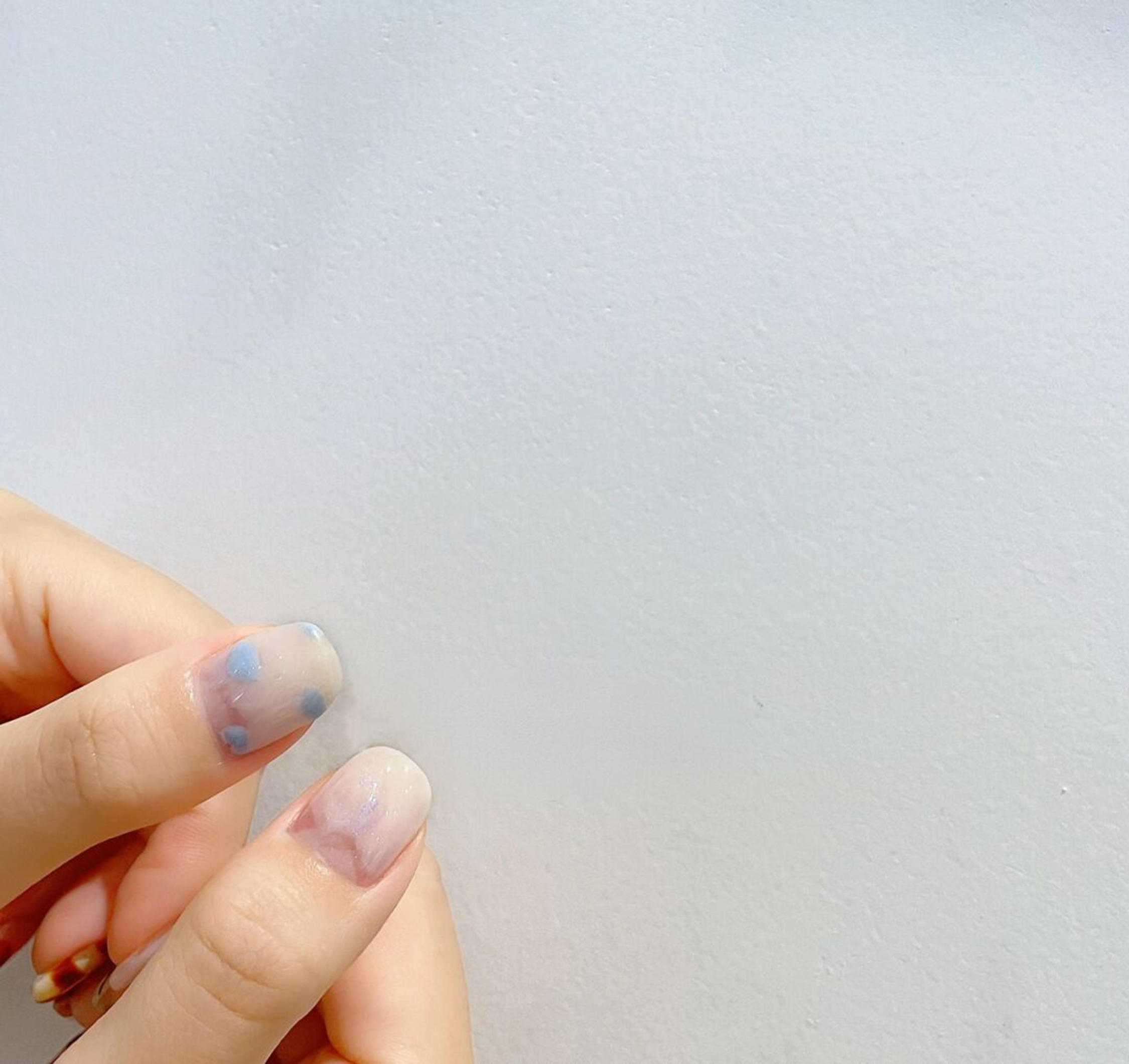 Blue and Nude Polka Dot Short Nails shown as a nail art design with blue, nude, polka dot and short details.