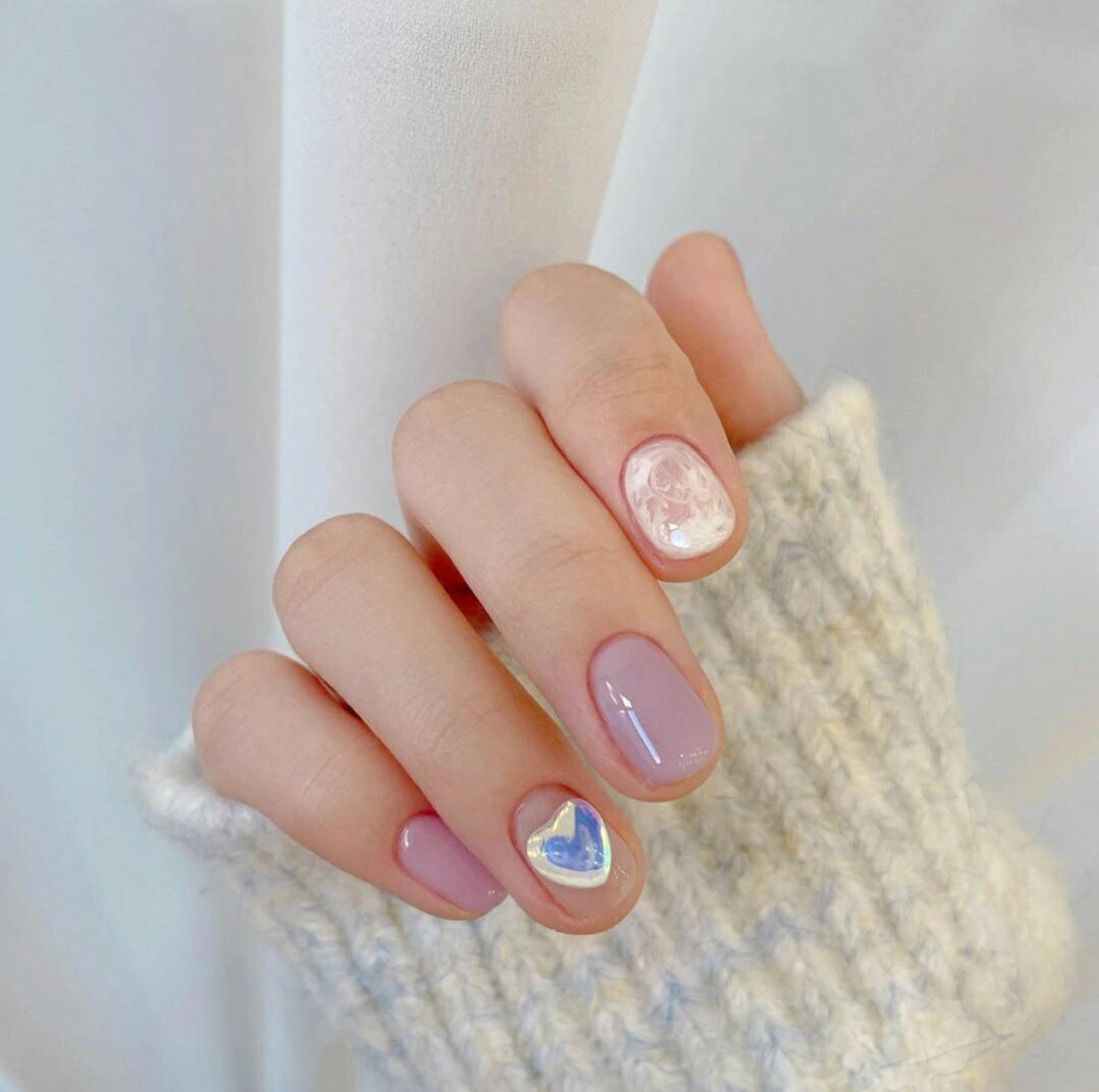 Pink, White and Blue Heart Short Round Nails shown as a nail art design with pink, white, blue, cute, marble, heart, swirl, round and short details.