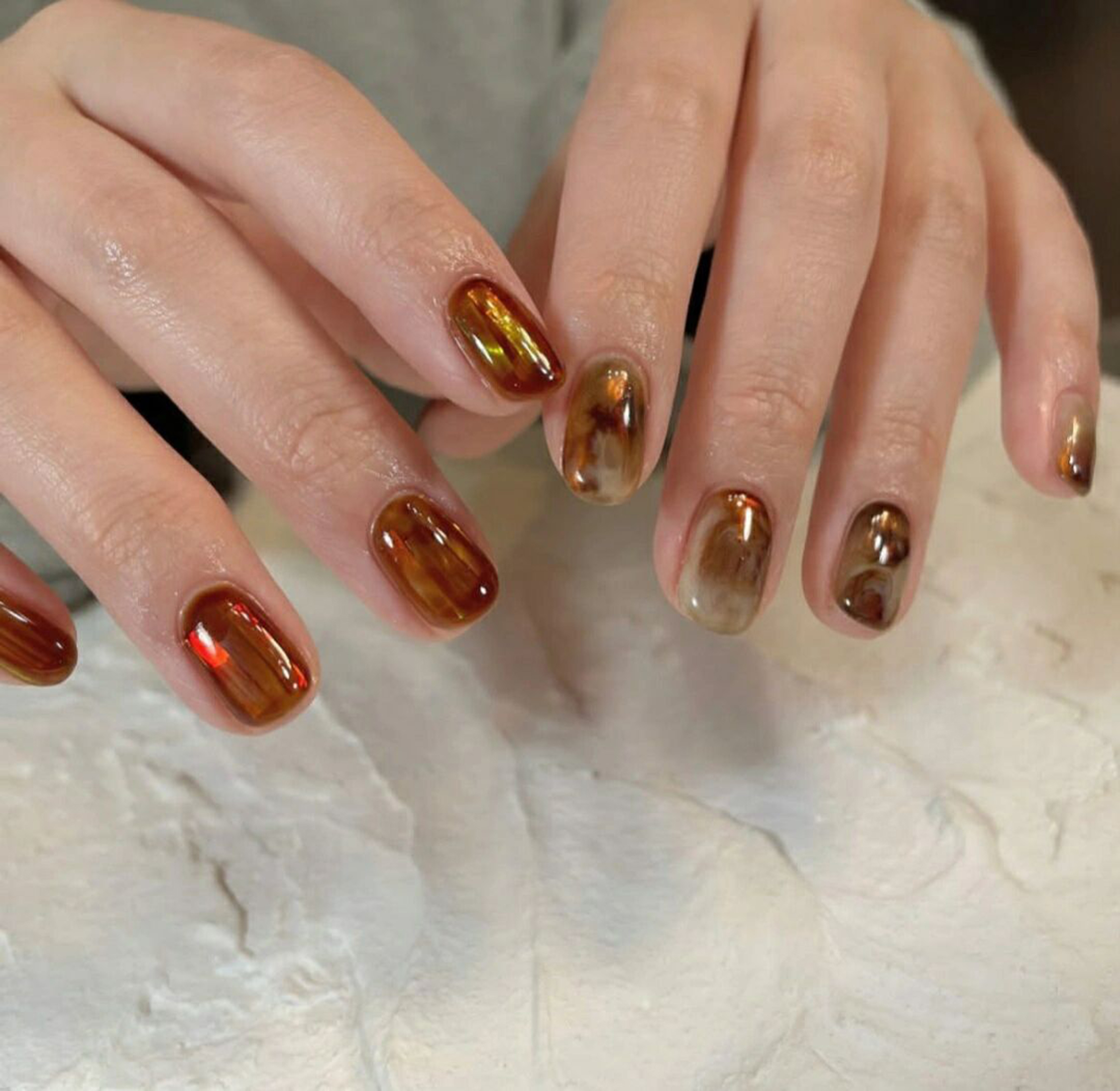 Brown Marble Short Oval Nails shown as a nail art design with brown, marble, oval and short details.