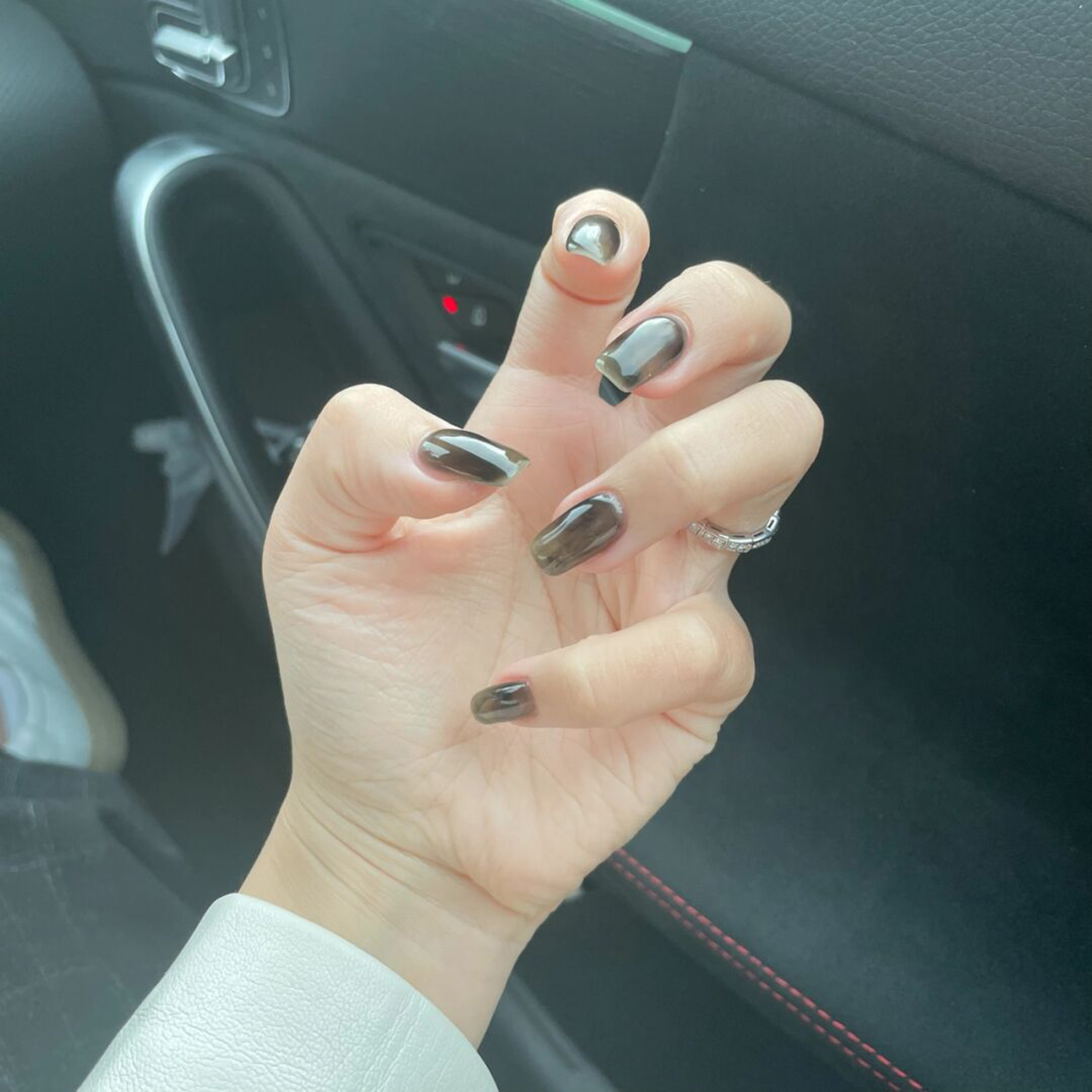 Black and Silver Chrome Nails shown as a nail art design with black, silver, chrome and medium details.