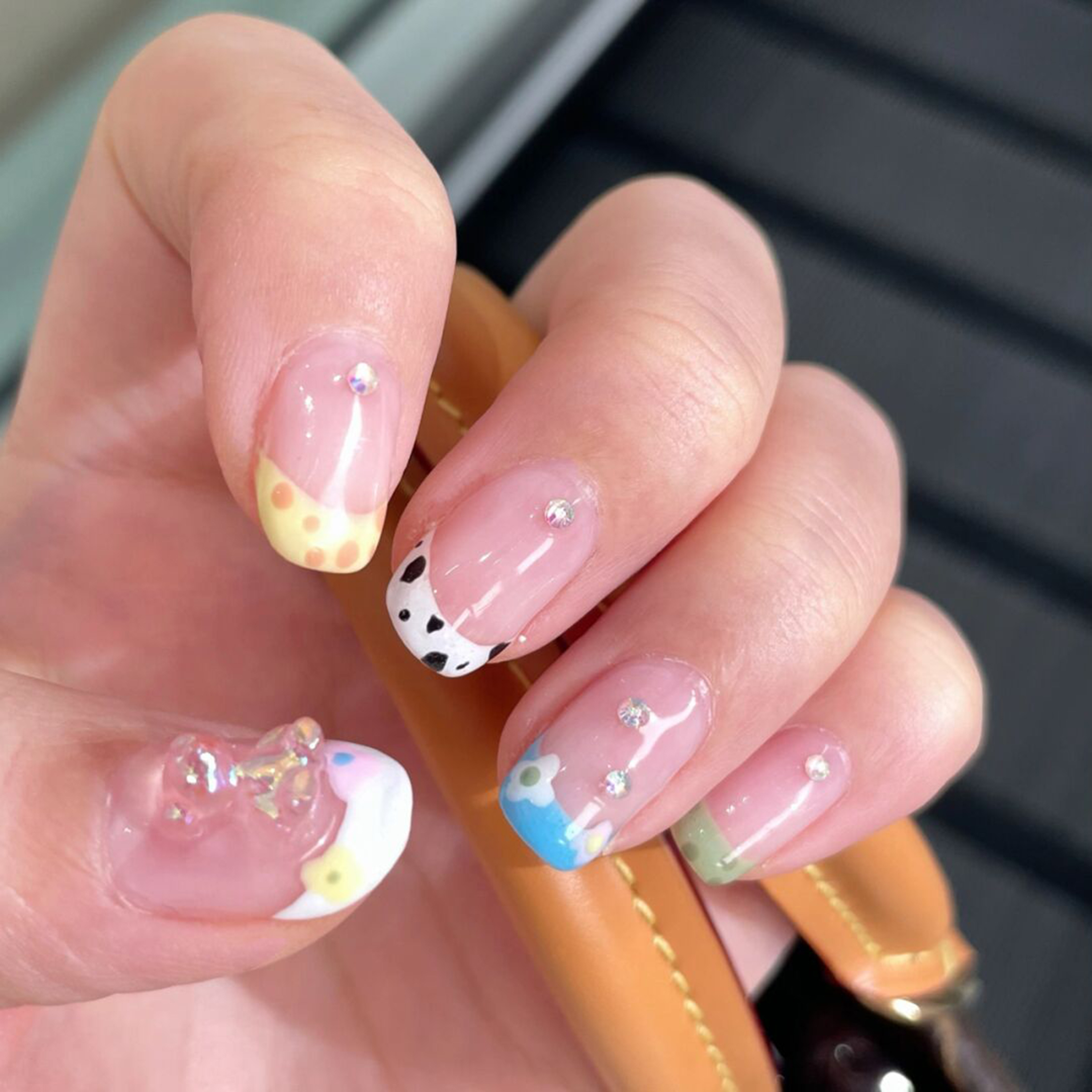Butter Yellow, Blue and Black Polka Dot Short Nails shown as a nail art design with butter yellow, blue, black, cute, floral, polka dot, daisy, cow print and short details.