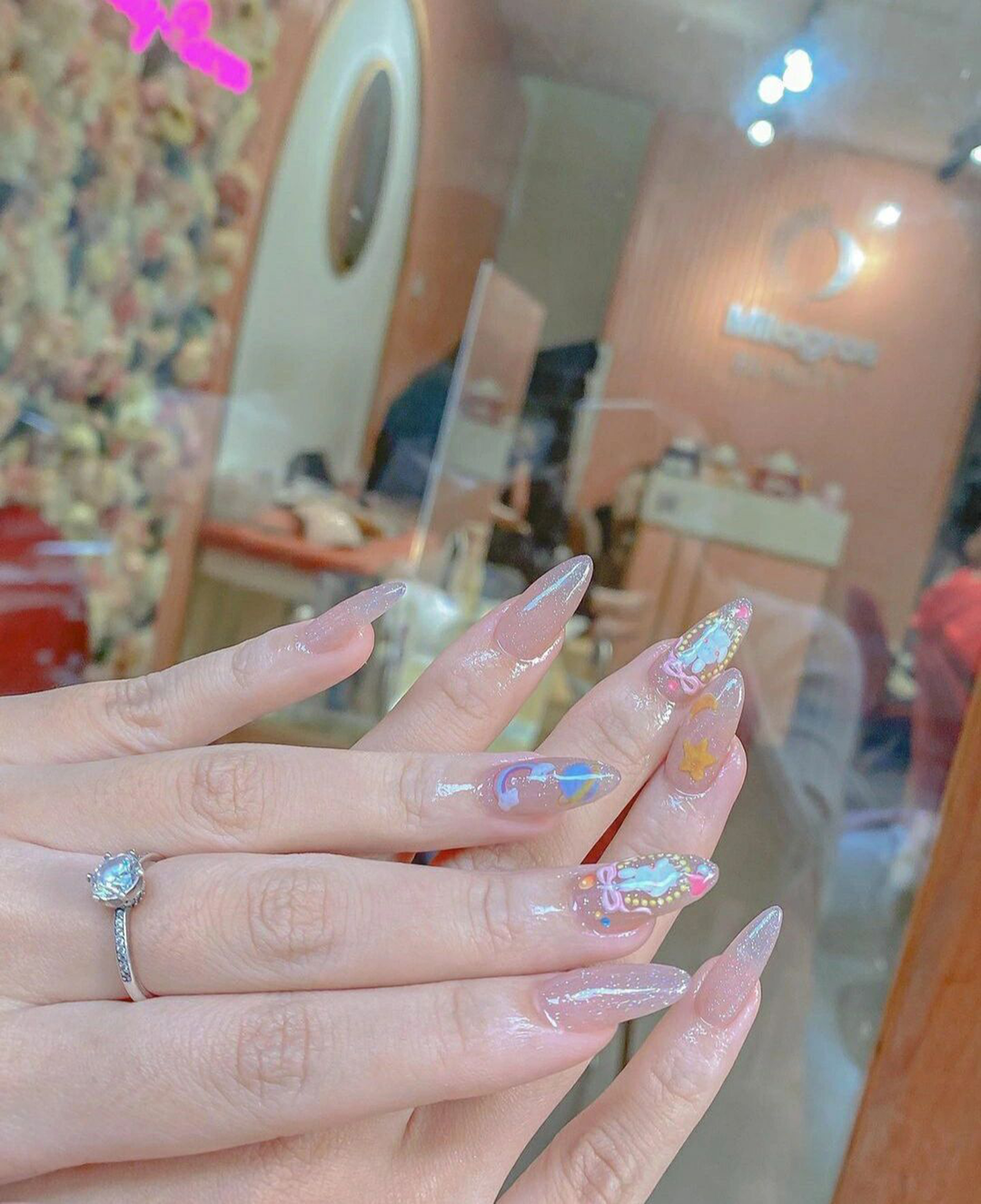 Nude Bow Long Almond Nails shown as a nail art design with nude, cute, star, bow, almond and long details.