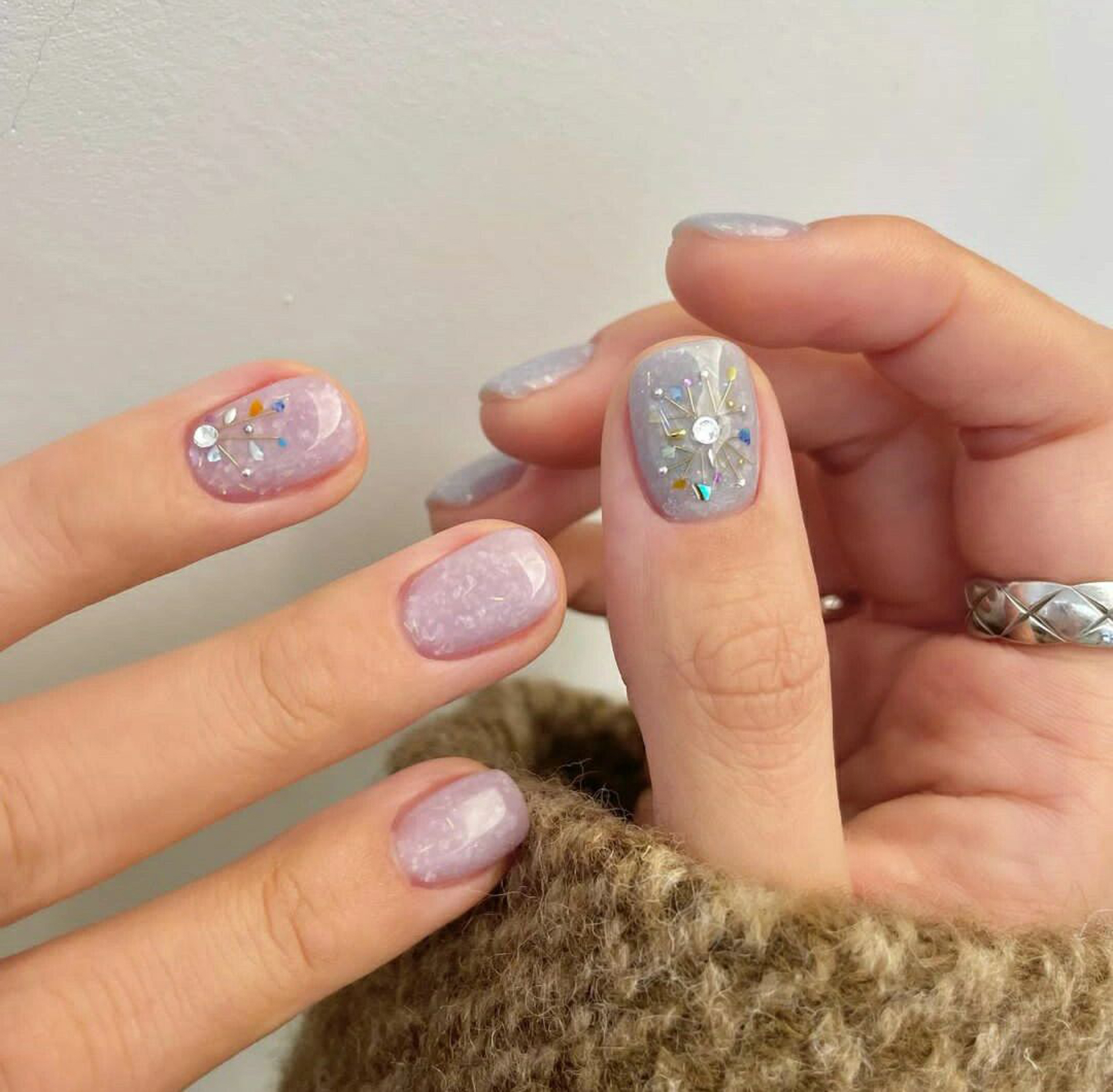 Pastel 3D Short Nails shown as a nail art design with pastel, 3d, marble and short details.