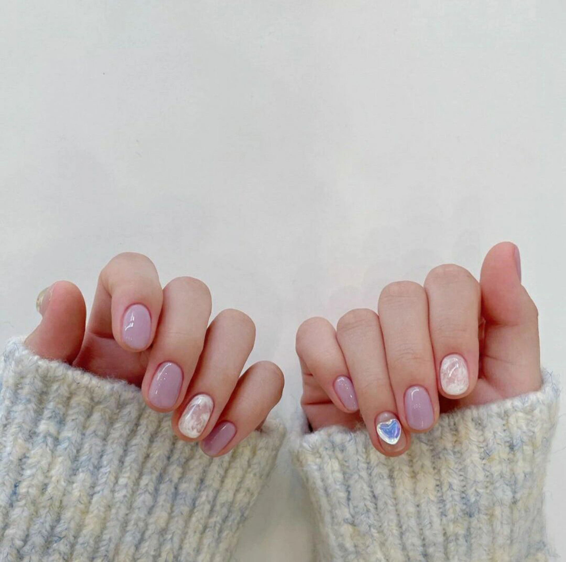 Pink, White and Blue Heart Short Oval Nails shown as a nail art design with pink, white, blue, marble, cute, minimal, heart, swirl, oval and short details.