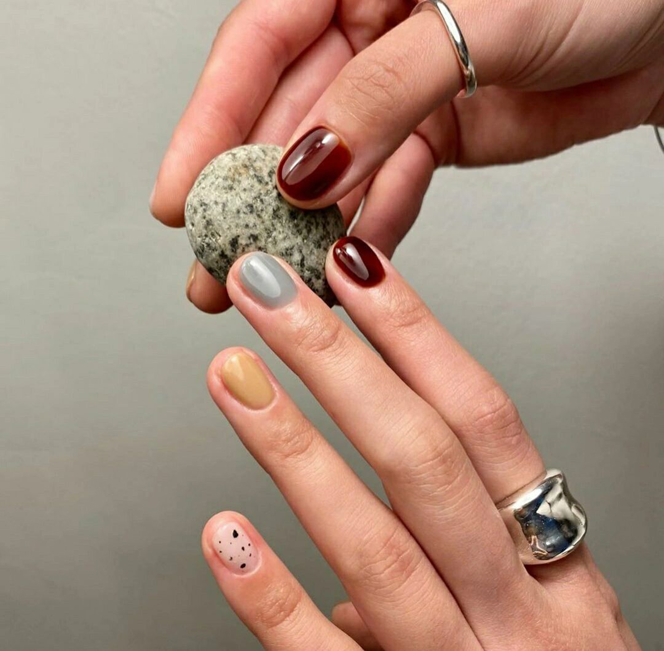Burgundy, Gray and Butter Yellow Polka Dot Short Oval Nails shown as a nail art design with burgundy, gray, butter yellow, minimal, simple, polka dot, oval and short details.
